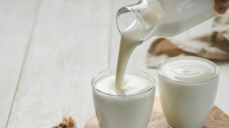 Pouring buttermilk in glasses