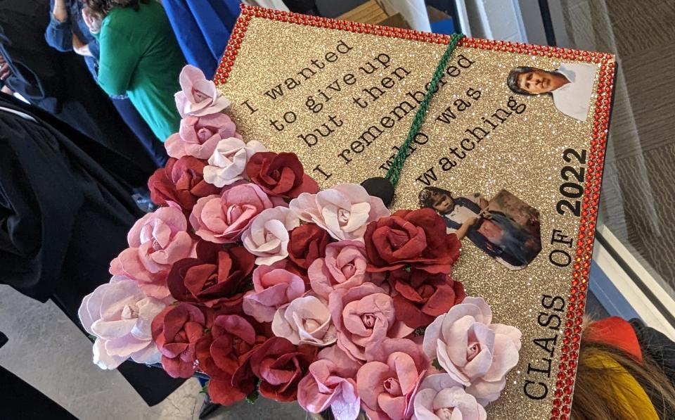 Jenifer Hernandez-Vargas' graduation cap is decorated with a picture of her at age 3 when she left Mexico with her father and mother.