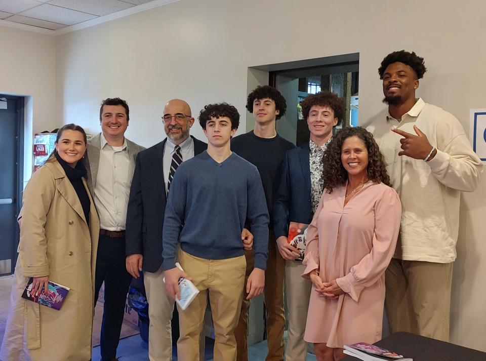 Buffalo Bills defensive end Gregory Rousseau grabs a photo with Co-Male Athlete of the Year Gennaro Picco and family at the 48th annual Hornell Sports Night Saturday, April 13, 2024 at The Main Place. The event supports the Special Olympics.