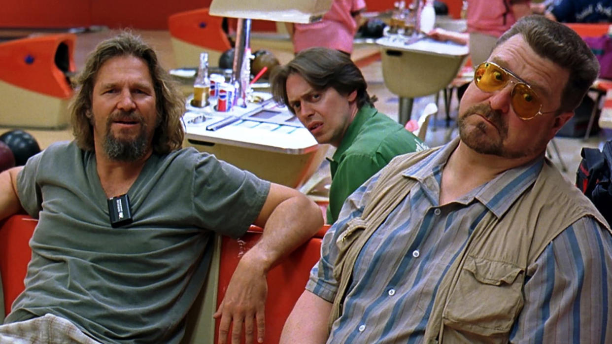  A still from The Big Lebowski showing Jeff Bridges, John Goodman and Steve Buscemi hanging out at a bowling alley. 