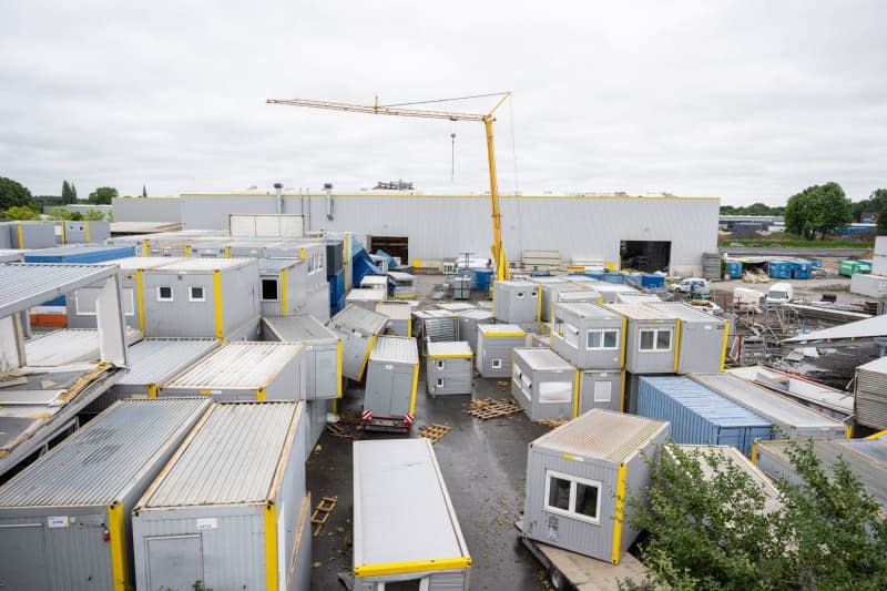 Containers overturned in the yard of a company that manufactures modular and systemic containers after a strong storm in Telgte.  Guido Kirchner/DPA