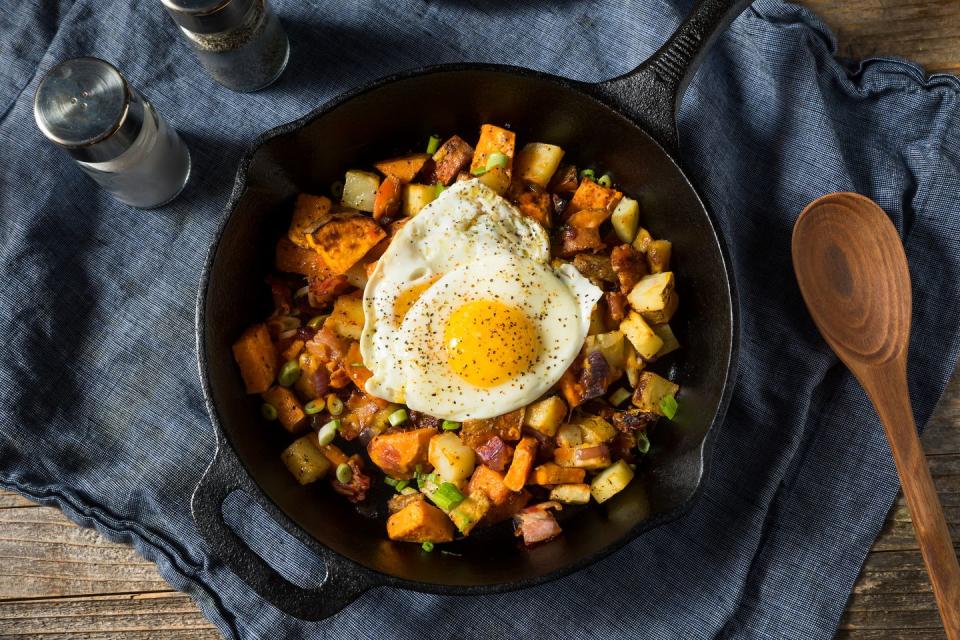 homemade healthy sweet potato hash with fried eggs