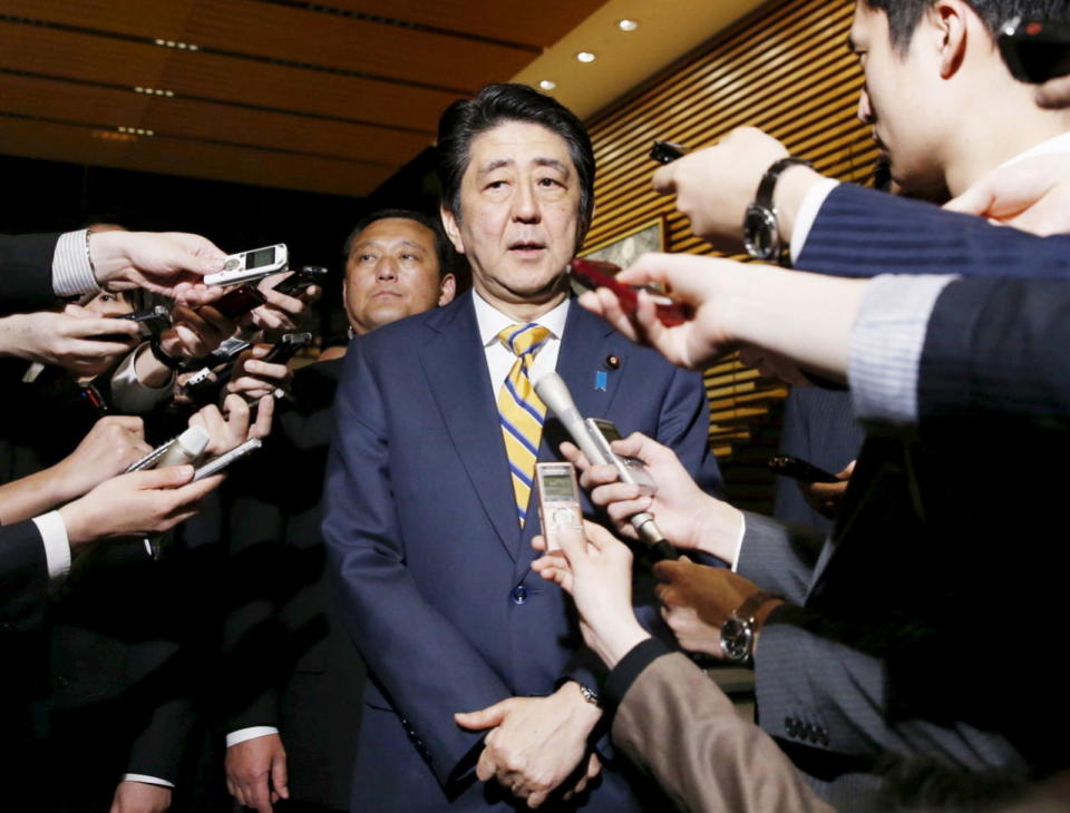 Prime Minister Shinzo Abe speaks to reporters