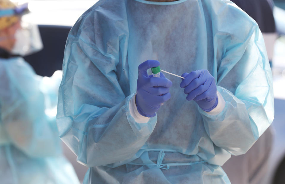 A testing swab is seen during community COVID-19 testing in Broadmeadows, Melbourne, Sunday, June 28, 2020.