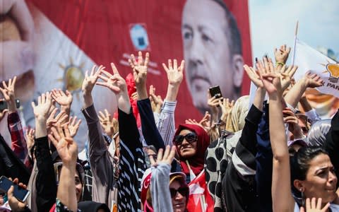 Mr Erdogan is popular with many Turks but has polarized the country - Credit: Berk Ozkan/Anadolu Agency/Getty Images