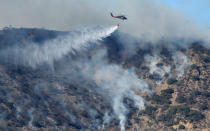 <p>Firefighters continue to battle the Thomas fire , a wildfire near Fillmore, Calif., Dec. 14, 2017. (Photo: Gene Blevins/Reuters) </p>