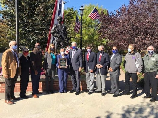 Essex County Executive Joseph DiVincenzo Jr. (center) presents the 2020 Essex County Community Star Award to Irvington resident Cheryl "Kit" Turner (fifth from left), a retired Air Force master sergeant and founder/CEO of New Hope Village 4 Veterans. (Photo: Essex County)