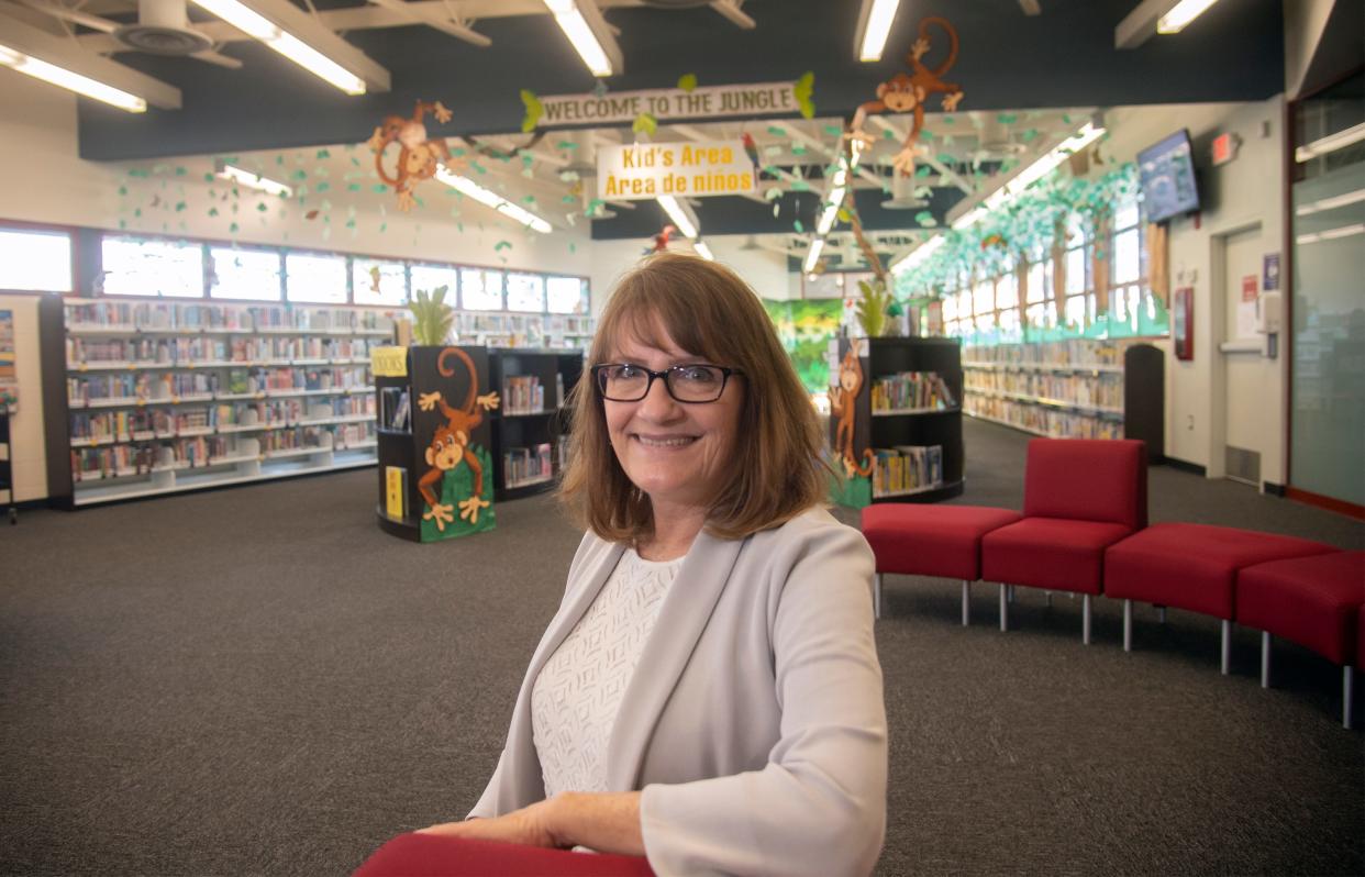 Retired Stockton community services director Suzy Daveluy checks out a display at the Fair Oaks Library in Stockton. Daveluy, who started out and worked most of her 32-year career in the Stockton-San Joaquin Public Library, retired in December.