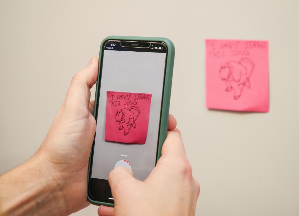James Workman Middle School teacher Shane Frakes storyboards a TikTok videos featuring his students reactions to an NSYNC video he showed in his Cathedral City, Calif., classroom on Feb. 21, 2023. 