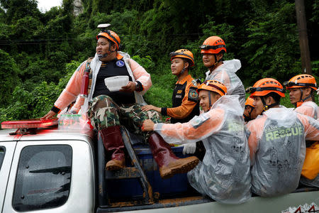 Rescue workers are seen near Tham Luang cave complex during a search for members of an under-16 soccer team and their coach, in the northern province of Chiang Rai, Thailand, June 28, 2018. REUTERS/Soe Zeya Tun