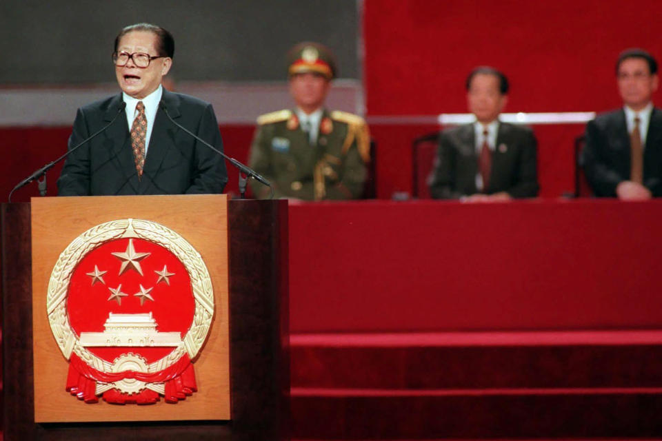 FILE - In this file photo taken July 1, 1997, then President Jiang Zemin delivers his speech during the handover ceremony in Hong Kong. Hong Kong has been living on borrowed time ever since the British made it a colony nearly 180 years ago, and all the more so after Beijing took control in 1997, granting it autonomous status. A national security law approved by China's legislature Thursday is a reminder that the city's special status is in the hands of Communist Party leaders who have spent decades building their own trade and financial centers to take Hong Kong's place.(Kimimasa Mayama/Pool Photo via AP)