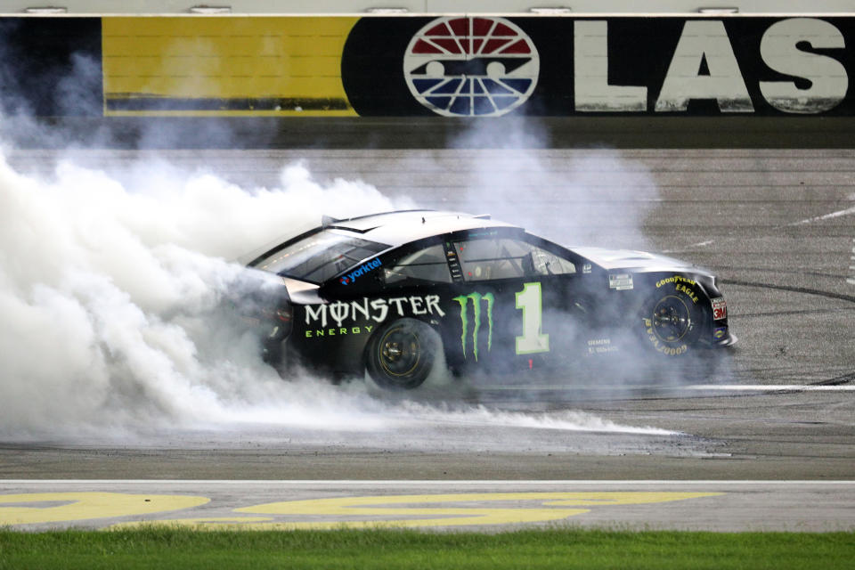 Kurt Busch celebrates with a burnout after winning the NASCAR Cup Series South Point 400 at Las Vegas Motor Speedway.