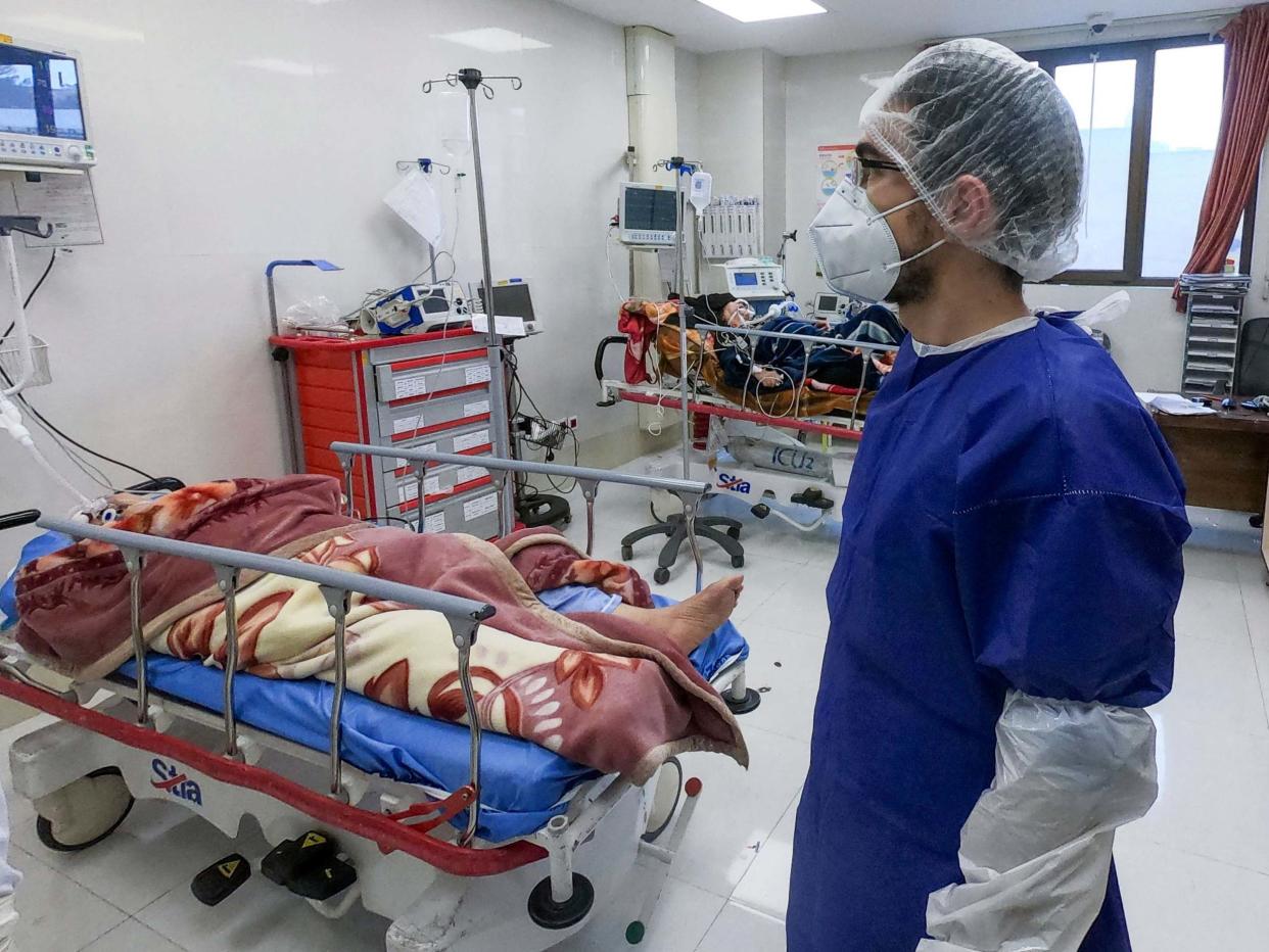 Nurse cares for patients in a coronavirus ward at Forqani Hospital in Qom, Iran: AP