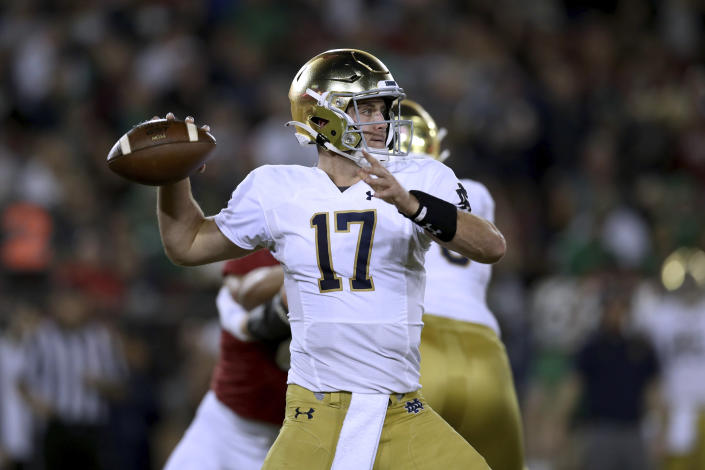 Notre Dame quarterback Jack Coan prepares to throw a pass against Stanford during the first half of an NCAA college football game in Stanford, Calif., Saturday, Nov. 27, 2021. (AP Photo/Jed Jacobsohn)