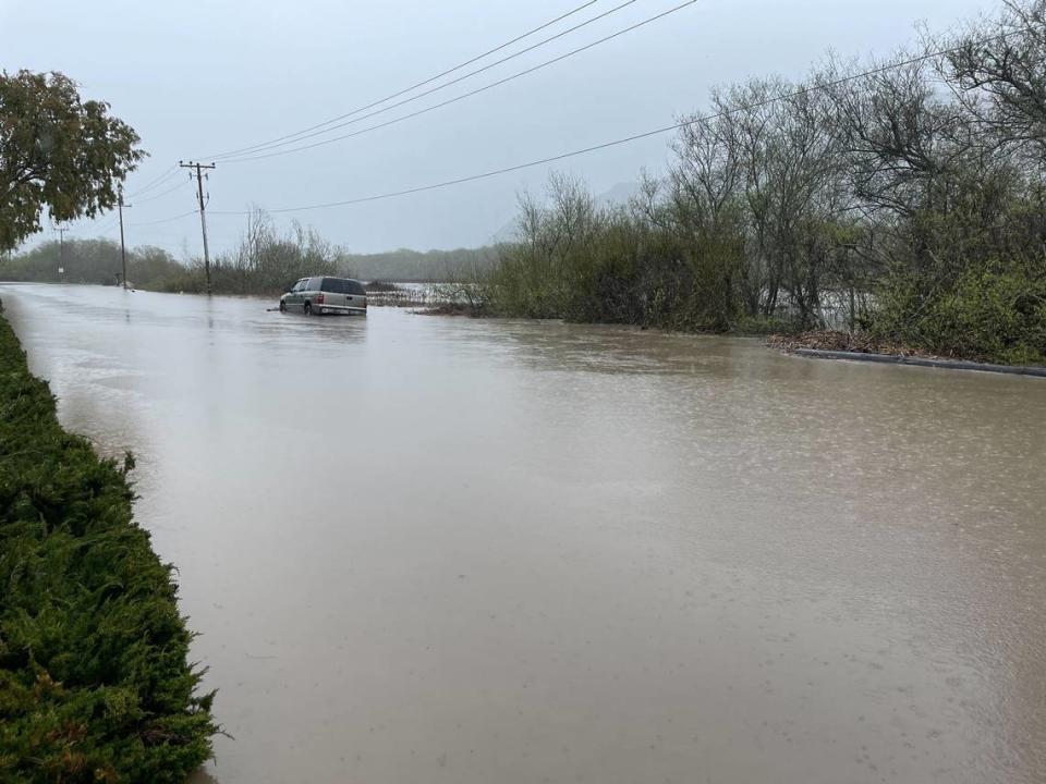 A car submerged in floodwaters on Quintana Road at South Bay Boulevard in Morro Bay.