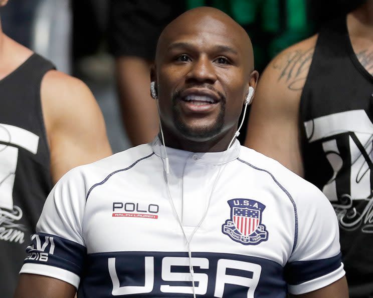 Floyd Mayweather Jr. watches boxing on Tuesday during the 2016 Summer Olympics. (AP)