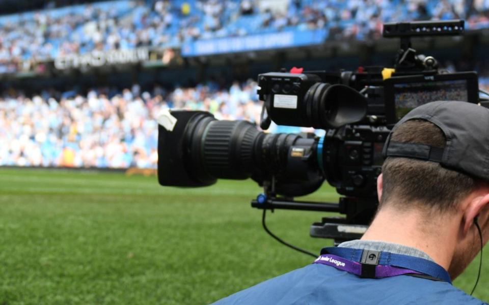 A cameraman at work at Manchester City's Etihad Stadium in 2018 — TV broadcasters still hold key to success of European Super League - GETTY IMAGES