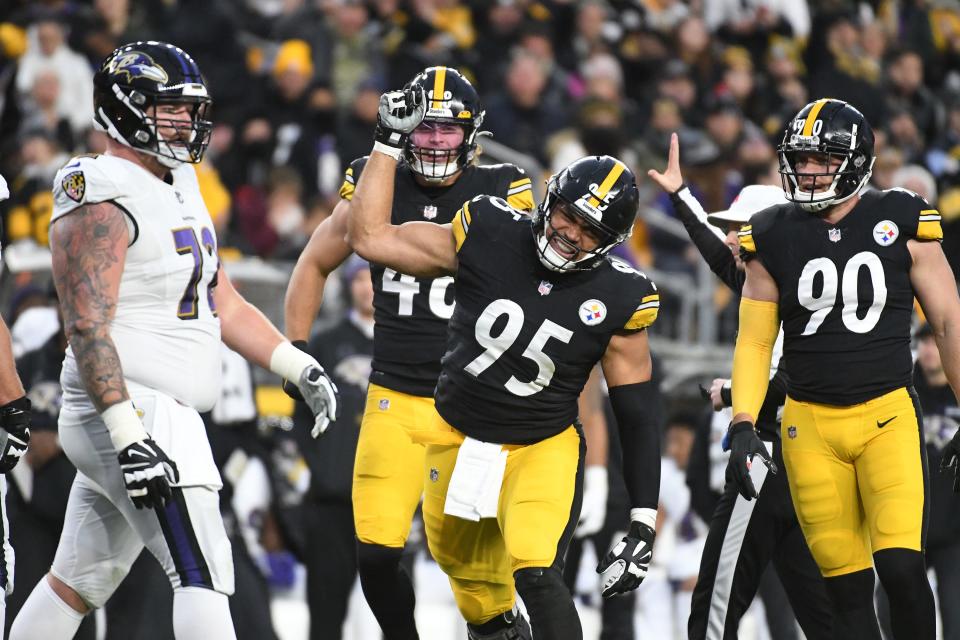 Pittsburgh Steelers defensive lineman Chris Wormley (95) celebrates a sack with linebacker Derrek Tuszka (48) and T.J. Watt (90) on Baltimore Ravens quarterback Lamar Jackson (8) during the first quarter at Heinz Field.