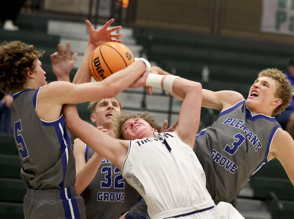 Brighton’s Josh Mawhinney is triple-teamed by Pleasant Grove’s Ryan Hadley, Clay Hansen and Makai Peterson in a neutral tournament game at Olympus High School in Holladay on Thursday, Dec. 28, 2023. | Laura Seitz, Deseret News