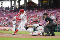 Cincinnati Reds' Michael Papierski (26) hits a two-run single during the third inning of the team's baseball game against the Philadelphia Phillies on Monday, Aug. 15, 2022, in Cincinnati. (AP Photo/Jeff Dean)