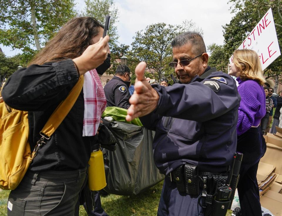 USC protesters interacting with police officer
