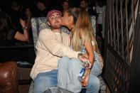 <p>Singer Ariana Grande cuddled up to her new boo, Mac Miller, at the Republic Records afterparty, looking might comfy in a pair of overalls. (Photo: Getty Images)</p>