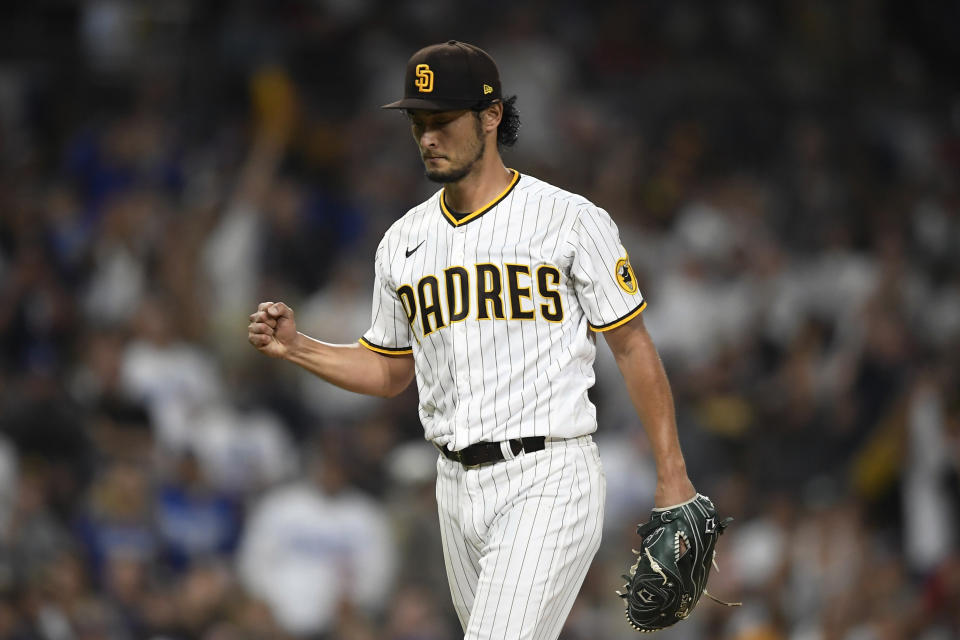 San Diego Padres starting pitcher Yu Darvish (11) pumps his fist after getting the final out during the sixth inning of a baseball game against the Los Angeles Dodgers, Monday, June 21, 2021, in San Diego. (AP Photo/Denis Poroy)