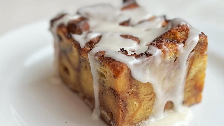 Closeup of a cinnamon roll bread pudding slice 