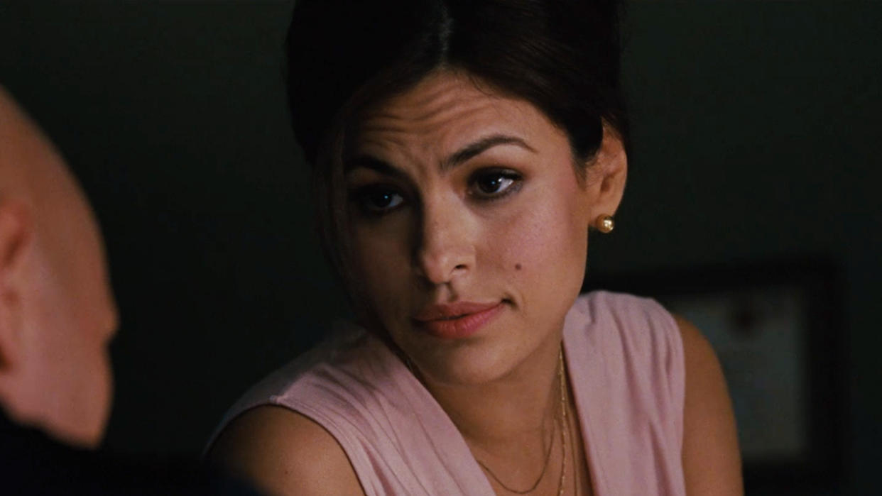  Eva Mendes sitting in a dim office in Fast Five. 