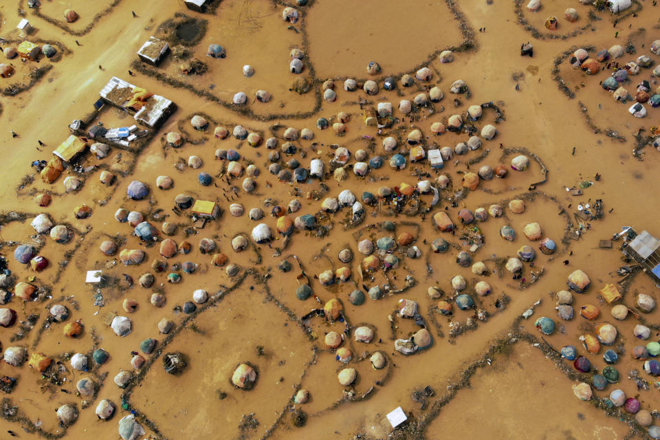 Huts made of branches and cloth provide shelter to Somalis displaced by drought on the outskirts outskirts of Dollow, Somalia, Sept. 19, 2022. Elections, coups, disease outbreaks and extreme weather are some of the main events that occurred across Africa in 2022. Experts say the climate crisis is hitting Africa “first and hardest.” Kevin Mugenya, a senior food security advisor for Mercy Corps said the continent of 54 countries and 1.3 billion people is facing “a catastrophic global food crisis” that “will worsen if actors do not act quickly.” (AP Photo/Jerome Delay)