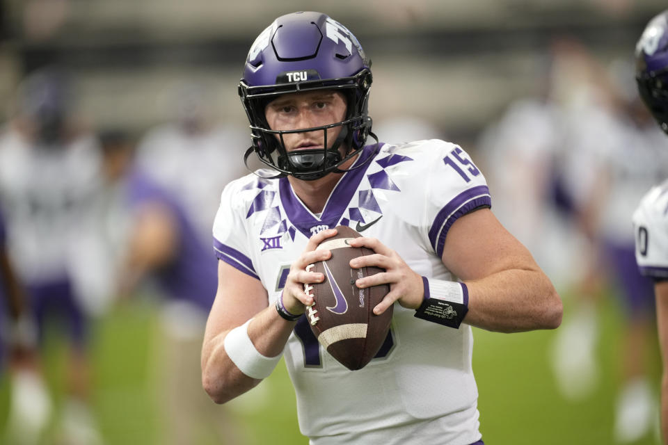 FILE - TCU quarterback Max Duggan (15) warms up before an NCAA college football game Friday, Sept. 2, 2022, in Boulder, Colo. TCU quarterback Max Duggan was selected top offensive player in the Associated Press Big 12 Midseason Awards, Tuesday, Oct. 11, 2022. (AP Photo/David Zalubowski, File)