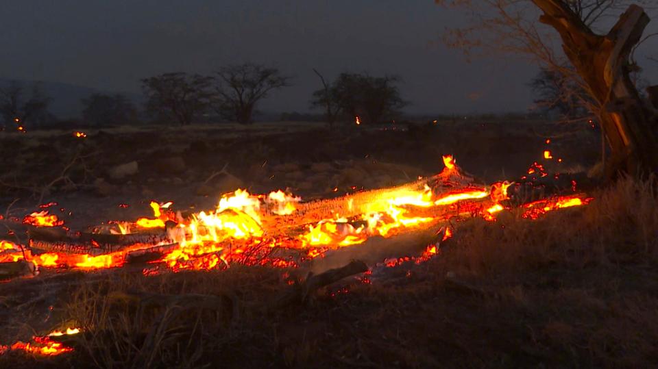 Flames from a wildfire burn in Kihei, Hawaii on Aug. 9, 2023.