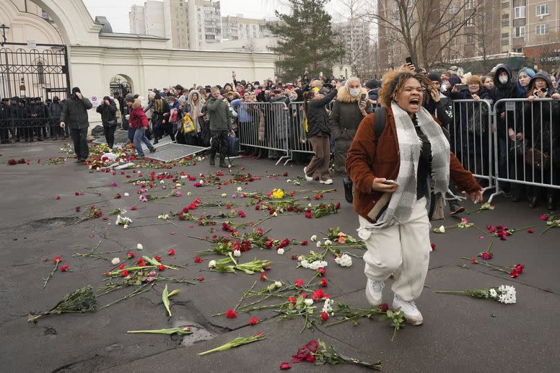 People break barriers after a van with the coffin of Russian opposition leader Alexei Navalny left the Church.