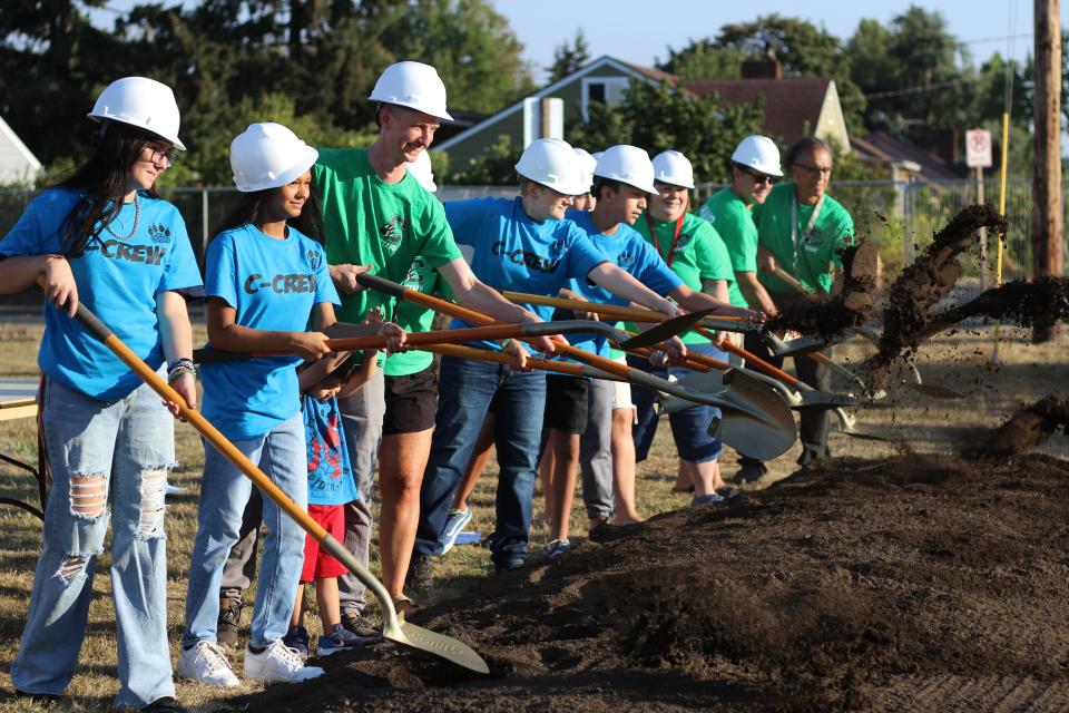 Students and teachers participate in Cascade Middle School's groundbreaking ceremony celebrating the start of construction for a replacement for the 66-year-old school on Wednesday.
