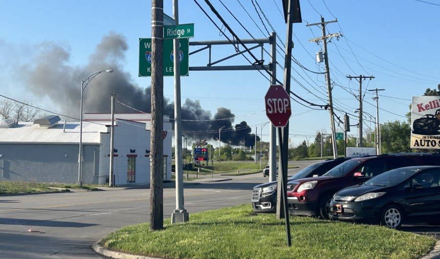 Smoke exiting the back of a semi-truck trailer has caused the evacuation of an area in North Franklinton. (NBC4/Ronald Clark)