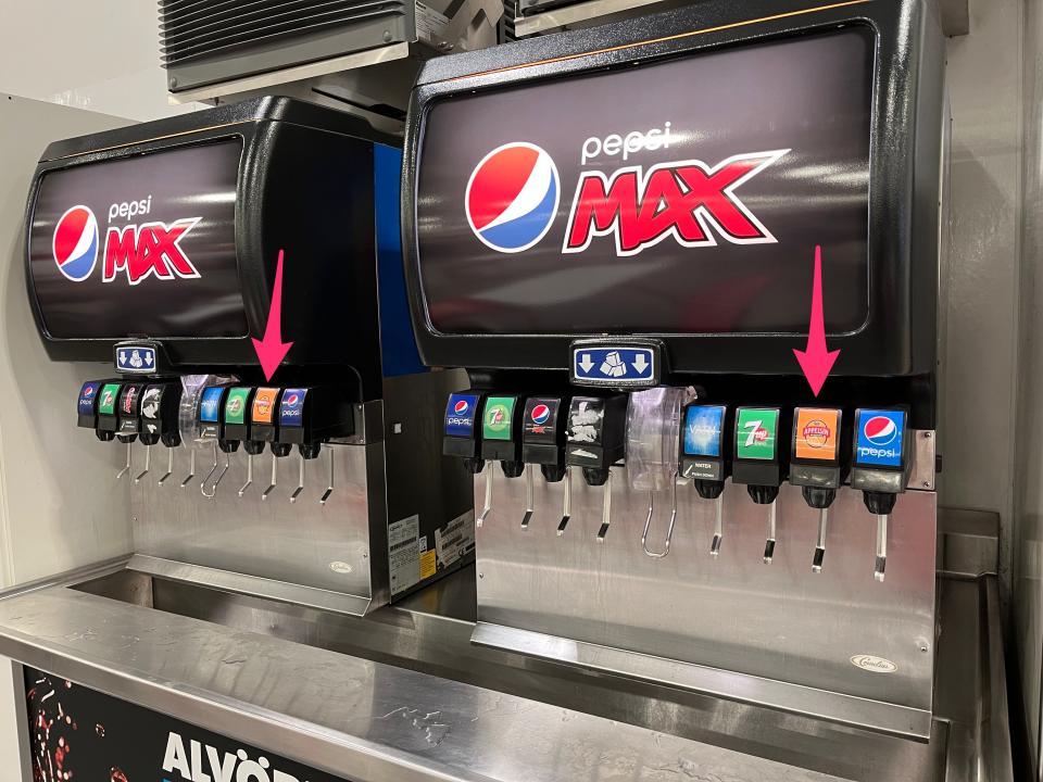 A soda fountain at Costco in Iceland featuring an orange-flavored Icelandic soda called Egils Appelsin.