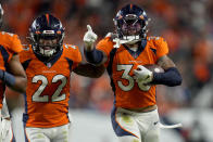 Denver Broncos safety Caden Sterns, right, celebrates an interception against the Indianapolis Colts during the second half of an NFL football game, Thursday, Oct. 6, 2022, in Denver. (AP Photo/Jack Dempsey)