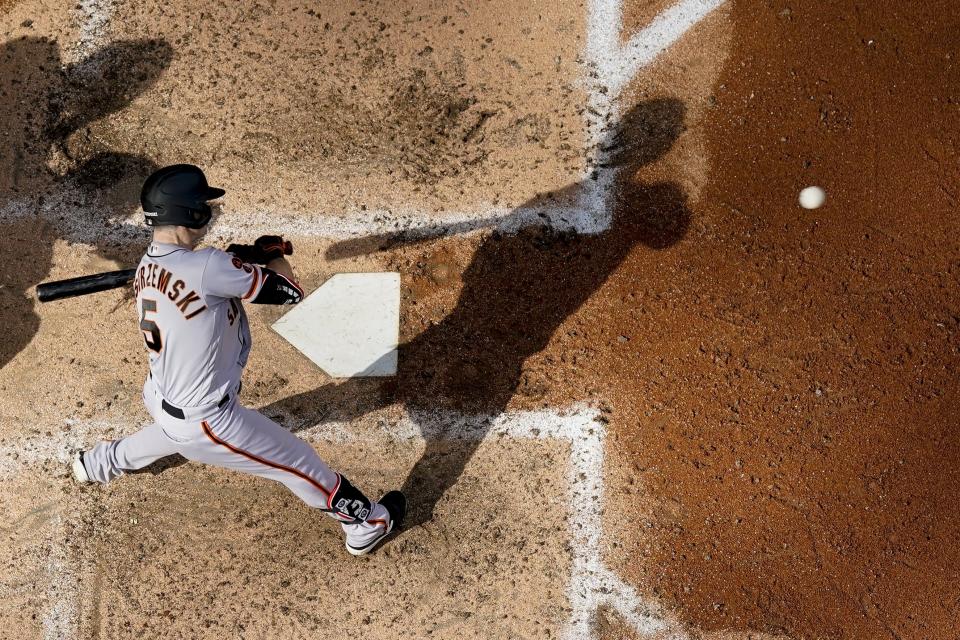 San Francisco Giants' Mike Yastrzemski hits a single during the sixth inning of a baseball game against the Milwaukee Brewers Saturday, May 27, 2023, in Milwaukee. (AP Photo/Morry Gash)