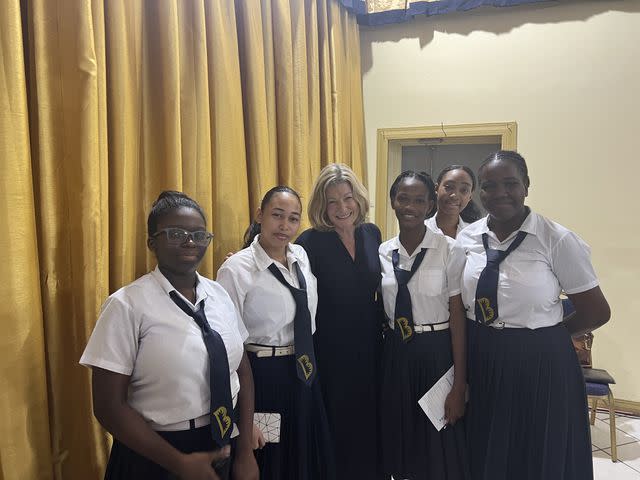 <p>Courtesy of Laura Trevelyan</p> Laura Trevelyan with a group of school girls in Grenada in February.