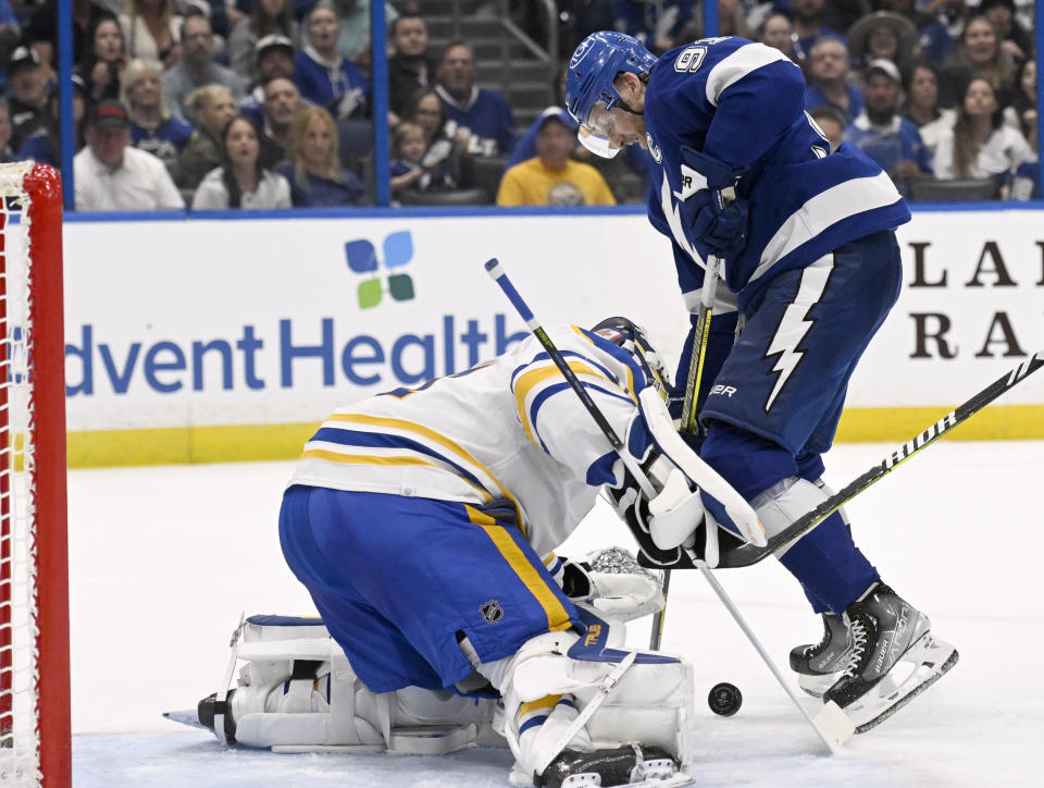 Tampa Bay Lightning center Steven Stamkos (91) looks for a shot against Buffalo Sabres goaltender Eric Comrie (31) during the second period of an NHL hockey game Thursday, Feb. 23, 2023, in Tampa, Fla. (AP Photo/Jason Behnken)