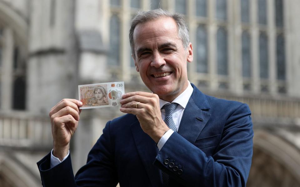 Bank of England governor Mark Carney with the new £10 note - Bank of England