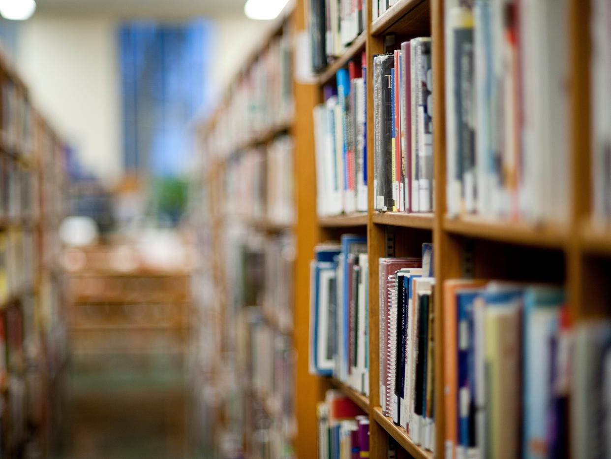 Books on shelf in library.