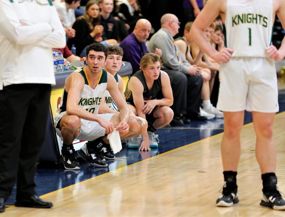Northeastern seniors Grant Luebbe (left) and Keaton Mikesell (center) and Hagerstown sophomore Anthony Kelley (right) wait to enter the sectional championship game March 4, 2023.