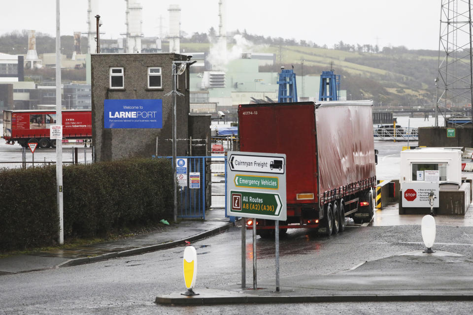Vehicles at the port of Larne, Northern Ireland, Tuesday, Feb. 2, 2021. Authorities in Northern Ireland have suspended post-Brexit border checks on animal products and withdrawn workers after threats against border staff. (AP Photo/Peter Morrison)