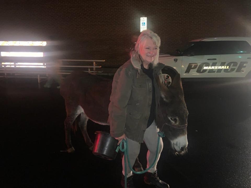 Pictured is Marla King with Millie, a donkey who has served in the Marshall Christmas Pageant for 12 years, according to King.