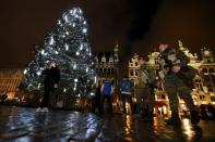 Belgian soldiers patrol Brussels' Grand Place on November 22, 2015, after security was tightened in Belgium following the fatal attacks in Paris. REUTERS/Yves Herman