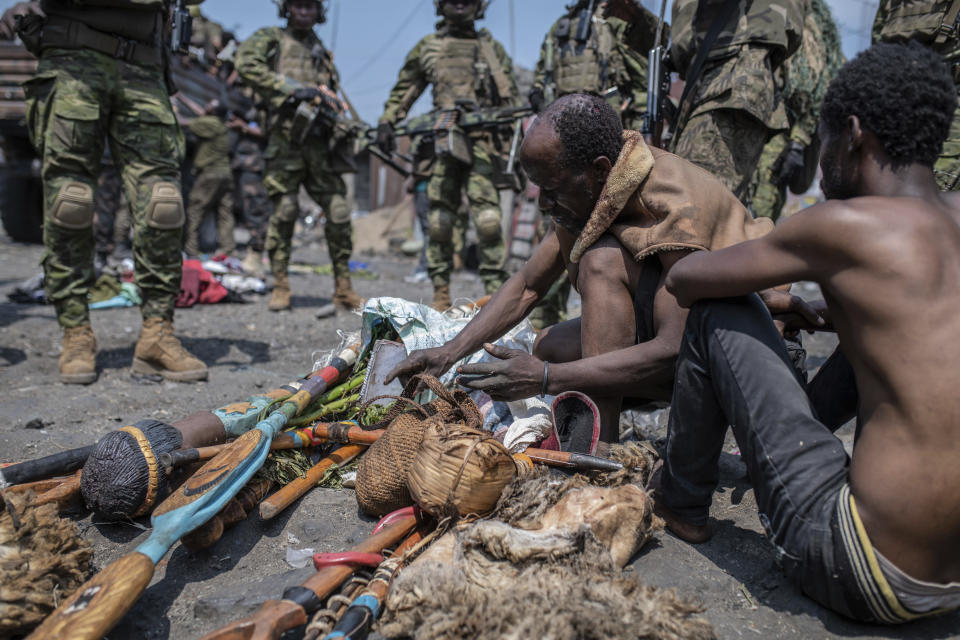 Arrested members of the Wazalendo sect are sat and lined up in Goma, Democratic Republic of the Congo, Wednesday, Aug. 30, 2023. More than 40 people died and dozens were injured in clashes in the Congolese city of Goma between protesters from the Wazalendo religious sect and the armed forces, national authorities said. (AP Photo/Moses Sawasawa)