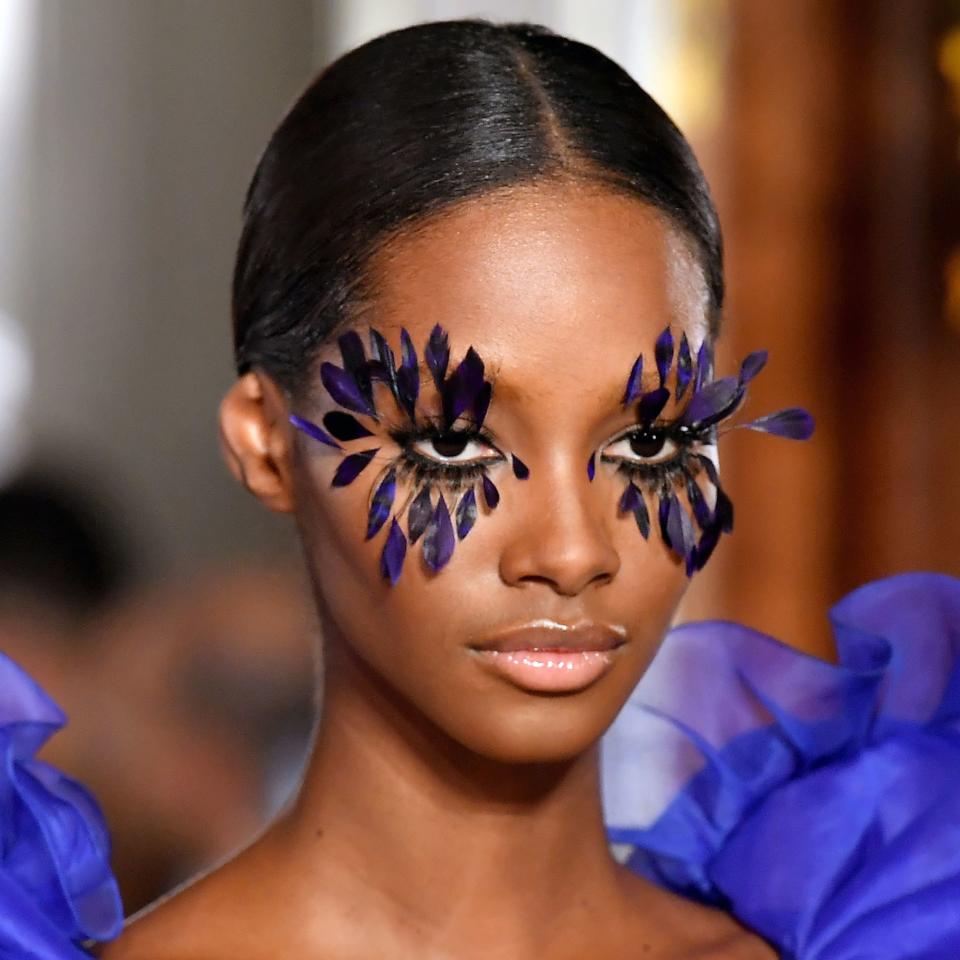 <h1 class="title">model with feather lashes at valentino</h1><cite class="credit">Getty Images</cite>