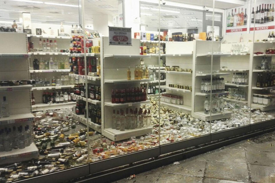 <p>Fallen bottles are seen in a liquor store following an earthquake on the island of Kos, Greece, July 21,2017. (Photo: Giannis Kiaris/EPA/REX/Shutterstock) </p>