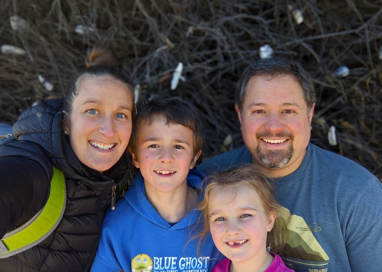 Nicole and Zachary Horn, owners of Blue Ghost Brewing Company, with their children.